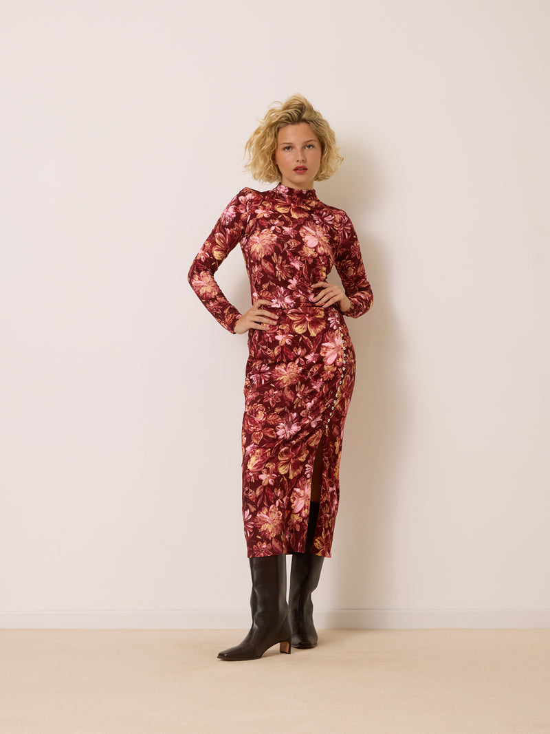 CLOTHILDA bordeaux floral print long dress worn on a model by Rouje