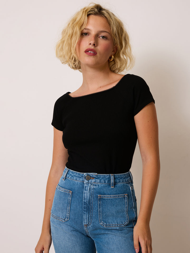 MELISSANE black ribbed-knit short-sleeve T-shirt worn on a model by Rouje